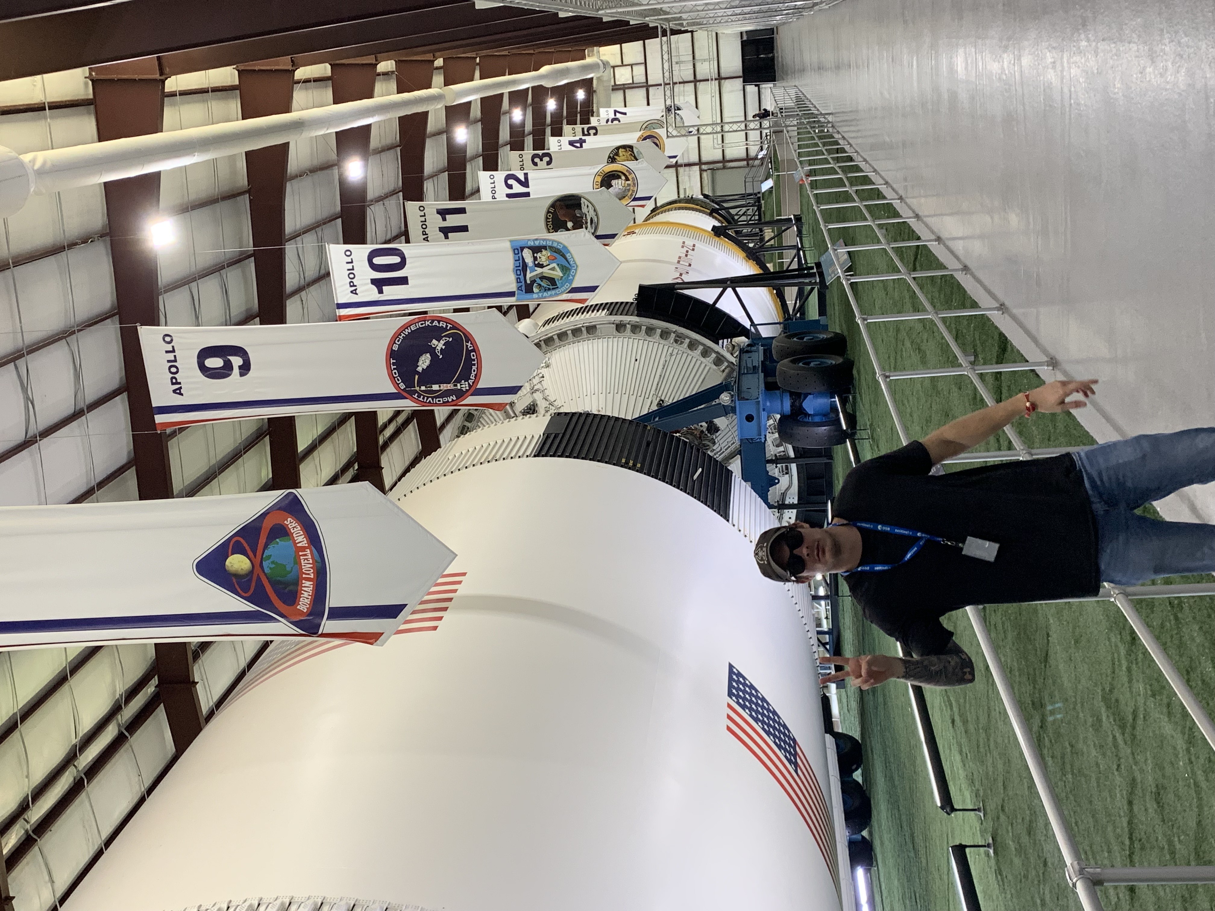Kevin at NASA Johnson Space Center with Saturn V rocket